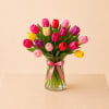 A fresh and elegant floral design featuring 12 premium tulips in a