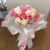 A delicate harmony of 36 pink and white roses, beautifully complemented by