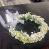White floral crown with small daisies and lace ribbon