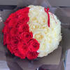 Red and white rose bouquet wrapped in dark paper