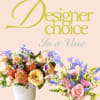 Two colorful flower arrangements in white vases against a pink background