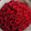 Large bouquet of red roses wrapped in paper