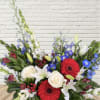 Mixed bouquet with red gerbera daisies, white roses, and lilies