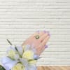 White rose wrist corsage with lavender ribbon and gold trim