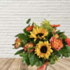Bouquet of sunflowers and orange roses in a vase