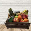 Wooden crate filled with assorted fruit and berry containers