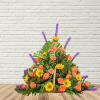 Basket arrangement of orange roses, yellow daisies, and purple spikes