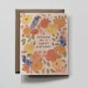 Birthday card with watercolor flowers and a brown envelope