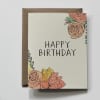 Birthday card with floral illustrations and a kraft envelope
