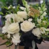 Elegant white and black graduation arrangement with gold accents and a shimmering