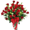 Bouquet of red roses with white flowers in a glass vase and red ribbon