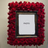 Red rose frame surrounding a central photo opening
