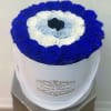 Round box of blue, white, and black roses