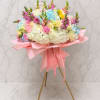 A lush display of pastel blooms makes this standing bouquet an unforgettable