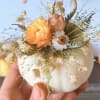 A mini Pumpkin with flowers it&acute;s ideal to decorated every space of