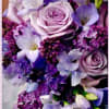 Lavender roses and purple flowers in a bouquet