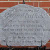 Engraved memorial stone with the word Grandfather and a poem