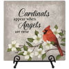 Decorative plaque with a cardinal, white flowers, and the text 