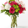 Bouquet of pink and white flowers in a clear glass vase