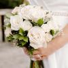 White rose bridal bouquet with green foliage