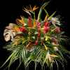 Tropical bouquet with orange bird-of-paradise and red flowers
