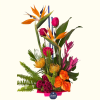 Tropical bouquet with orange bird-of-paradise and pink roses in a pink container