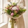 A romantic French garden-style bouquet designed with lush peonies or garden roses
