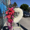 Heart shaped spray with flowers arranged on the side. 

*Order must be