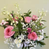 Delicate pinks, touches of whites and greens arranged naturally for the perfect