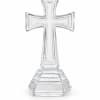 Clear glass cross-shaped decorative stand on a white background