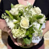 An elegant seasonal garden mix in creamy whites and greens. Arranged low
