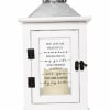 White memorial lantern with a printed sympathy message