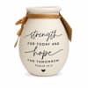 Cream ceramic vase with the words strength and hope printed on it