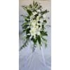 Tall white floral standing spray on a tripod easel