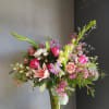 Mixed pink and white bouquet in a clear glass vase