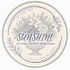 Round sympathy arrangement label with pastel flowers in a vase