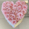 Heart-shaped box filled with pale pink roses