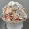 Round bouquet of white orchids and pastel roses in a white hat box