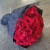 Select this stunning hand tied bouquet of 50 medium stem red roses