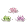 Three crystal lotus-shaped candle holders in pink, green, and purple