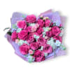 A lush cluster of bright pink roses takes center stage in this