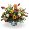 Mixed bouquet in a light blue vase with sunflowers, roses, and white blooms