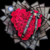 A dense heart-shaped cluster of bright red roses makes an unmistakable statement-the