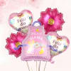 A festive cluster of pink, white and purple foil balloons that announces