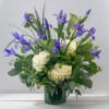 The Iris Garden Arrangement is a serene, refined floral design that highlights