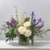 Embrace tranquility with this stunning flower arrangement that captures the essence of