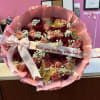 Bouquet of red and blush roses with a pink ribbon and Valentine message