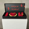 Black gift box with red roses and a "Will You Be My Girlfriend?" message