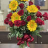 Bold red roses meet sunny sunflowers in a striking summer-ready bouquet that