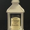 White lantern with a memorial message card inside